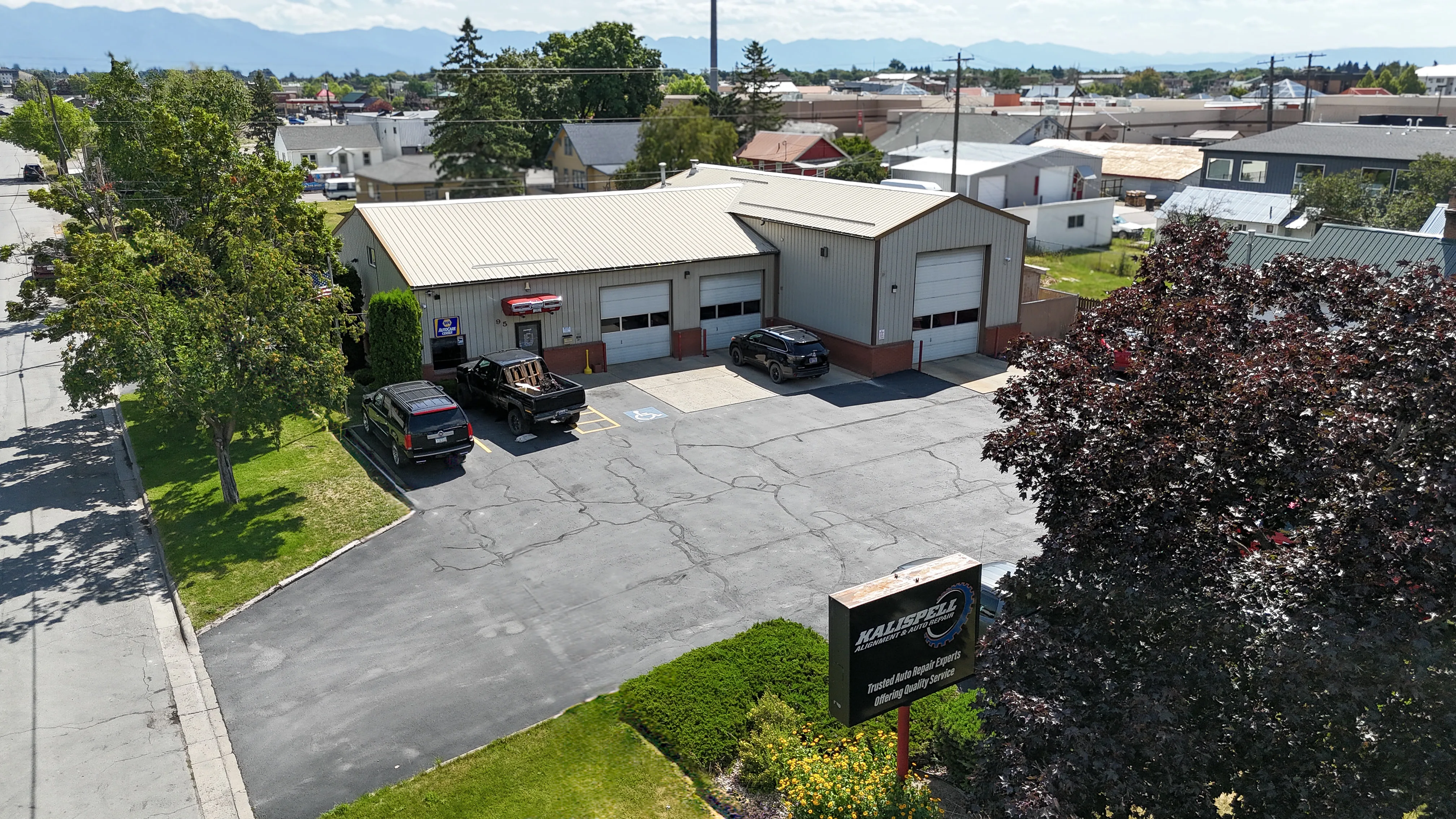 Aerial view of the KAAR shop in Kalispell, MT, showing the bays, parking lot, and signage
